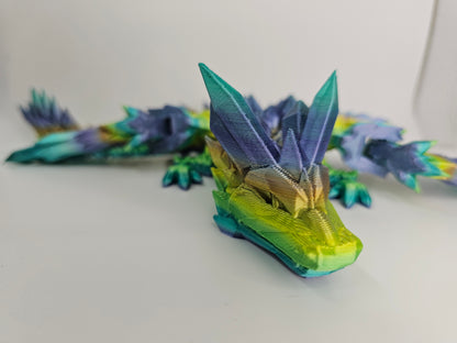 Rainbow Colored 3D printed Dragon. Fully flexible